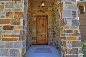 From here we'll begin our "walking tour" of the house! Enter through a lodge like wooden door with a large metal deer knocker.