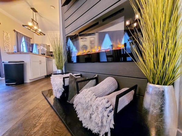 Main floor fireplace with throw blankets for winter evenings