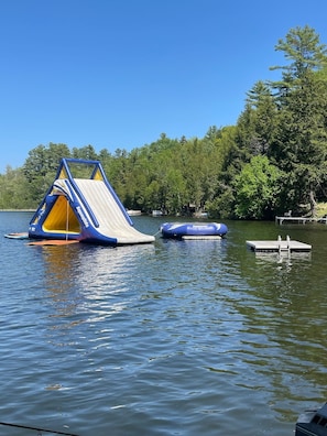 Water slide, trampoline and floating swim dock