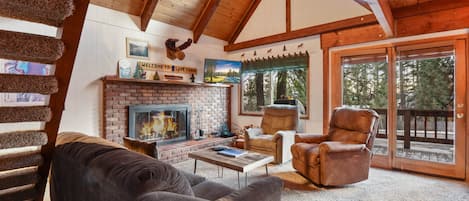 Mountain style living room with fireplace, flat screen TV, wifi, and DVD player