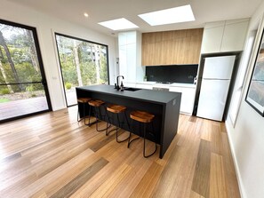 Bright, open kitchen to outside deck