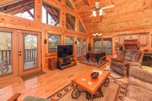 Open floor plan with kitchen, dining area, and living area to back porch