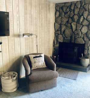 Reading area next to cozy pellet stove. 