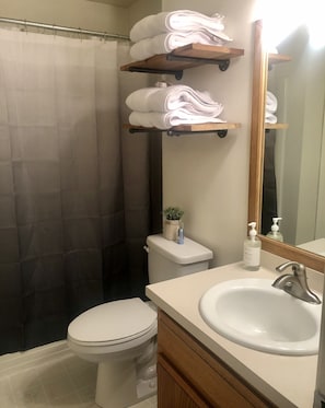 Bathroom with shower/tub combo. 