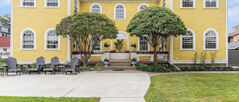 Facing the building, The Oakland South is on the right, and shared patio on left