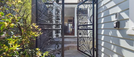 Secure front entry gates with intercom.
