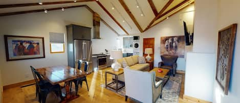 Beautiful high beam ceilings in open concept living area