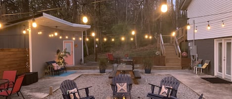 Shared outdoor courtyard with firepit and charcoal grill