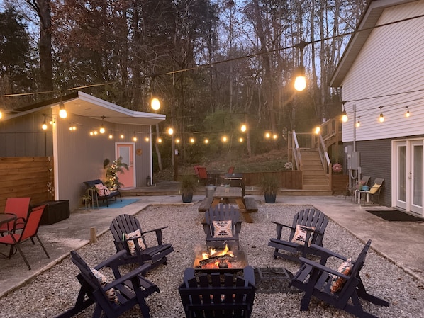 Shared outdoor courtyard with firepit and charcoal grill