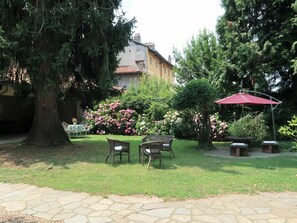 Plant, Building, Window, Table, Shade, Outdoor Furniture, Outdoor Table, Tree, Land Lot, Grass