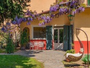 Plant, Building, Property, Window, Flower, Door, Purple, House, Grass, Wall