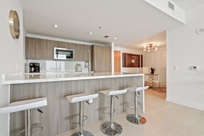 Kitchen peninsula provides four counter stools