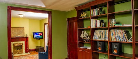 Custom office and bookshelves with old growth pine hardwood floor restoration.