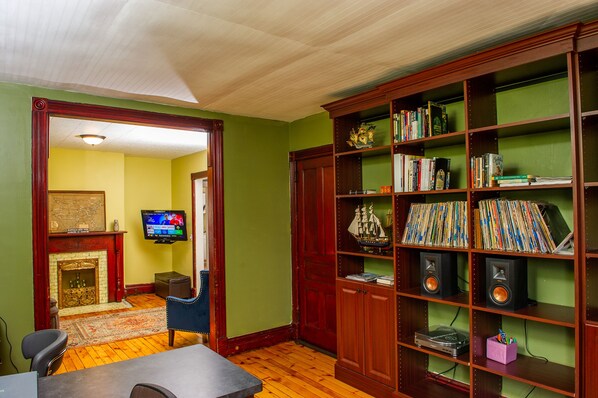 Custom office and bookshelves with old growth pine hardwood floor restoration.