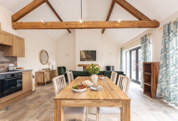 Ground floor: The open-plan living space features high ceilings and exposed beams giving a contemporary and modern feel