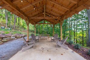 Common area includes two charcoal grills and a fire pit