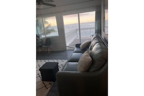 Living room looking out to deck and ocean