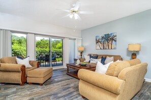 Cozy Living Room filled with Natural Sunshine from the Sliding Doors