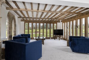 Ground floor: Sitting room with exposed beams, wonderful views and a 55 inch Smart television