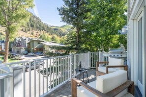 This stunning deck offers amazing views, cozy seating, gas grill and private hot tub.
