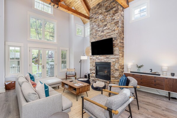 This tri-level luxury home boasts an open floor plan that offers the perfect space  for gathering with family and friends after a day of adventure.