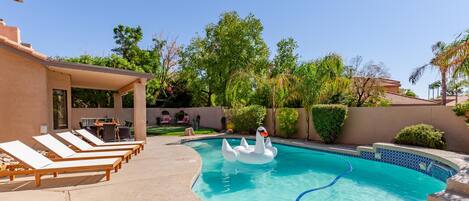 Private resort backyard with pool, putting green and outdoor dining!