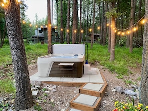 NEW! Elevated Hot Tub area just steps up from the backyard deck.