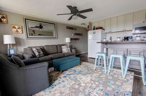 The comfortable living room has a sleeper sofa for additional sleeping capacity.
