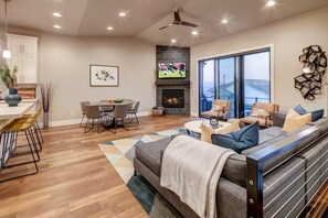 Great room with fireplace, Uinta mountain views, plenty of seating. Deck has grill (deck furniture coming Spring 2021).