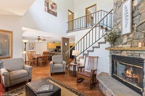 Another perspective of living room, peering into dining room and kitchen