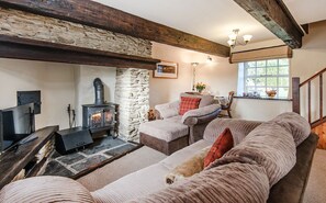 Foxglove cosy sitting room with log burning stove