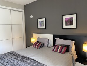 Bedroom with twin beds and ample storage