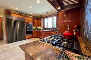Spacious kitchen with top of the line Wolf appliances