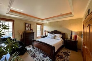 Elegant master bedroom with a king bed