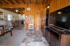 Beautiful tile flooring and wood paneling.