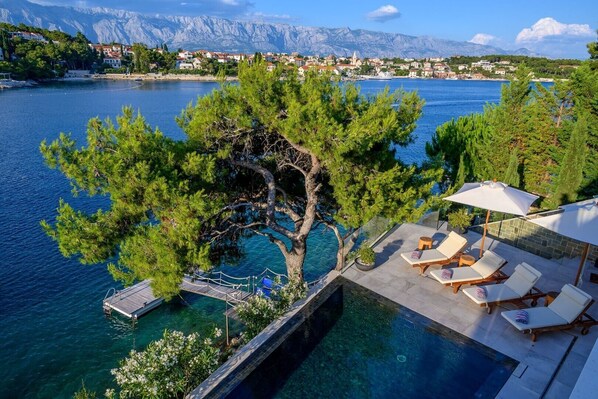 Outdoor heated pool in luxury Villa Prestige Brac with pool and gym by the sea