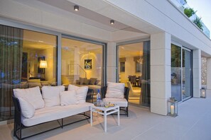The outdoor terrace of the luxury holiday villa My Dream on Brač with a sofa and a small table