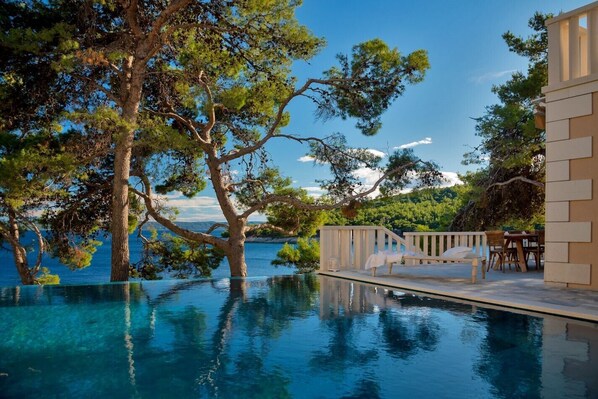 A magical view of the beautiful blue sky from the spacious outdoor terrace of the luxury vacation villa Brač