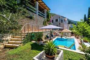 Terrace with private pool and jacuzzi of Croatia luxury villa for family vacation by the sea