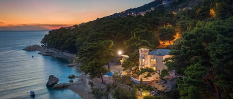 Aerial view of Croatia uxury Beachfront Villa Sea Palace with private pool, jacuzzi, sauna and gym right at the beach in Lokva Rogoznica in Omis