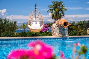 Lounge chair by the pool of a vacation house Mir on Brac Island