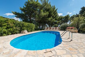 Subathnig area by the pool in Bol luxury beachfront Croatian villa Osasis for vacation and rent.