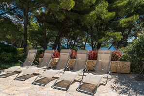 Subathnig area by the pool in Bol luxury beachfront Croatian villa Osasis for vacation and rent