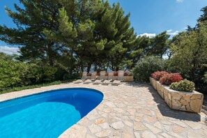 Outdoor private pool with stone plateau in Brač beachfront luxury villa Oasis for vacation and rent, Croatia