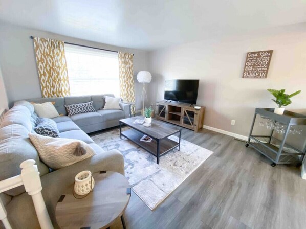 Upstairs living area with 50" Roku streaming TV and plenty of natural light
