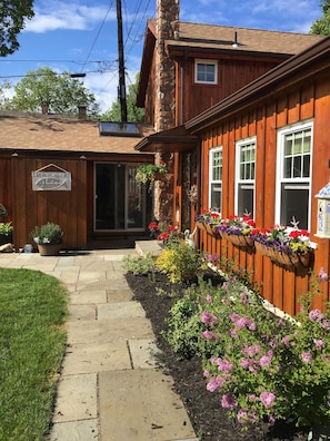 Beautiful landscaping with blue stone walkway 