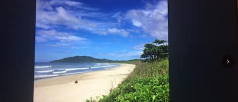 Looking north towards Playa Grande village from private entrance to beach