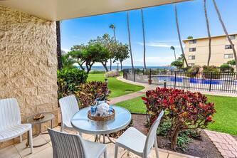 Ground-floor condo with ocean view, steps to beach
