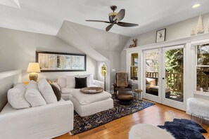 Cozy up on the softest couch ever, bask in the warmth of the fireplace, or open the doors to your private porch for a serene outdoor escape.