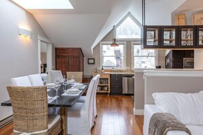 Natural light pours in from multiple angles, creating a bright, airy, and inviting atmosphere throughout the space.